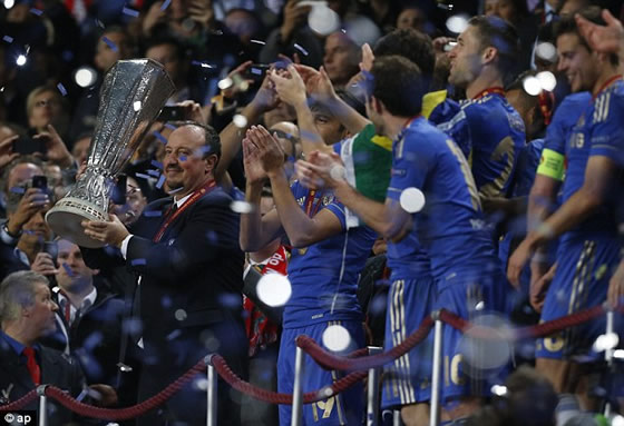 Rafa Benitez smiles as he lifts the Europa League trophy in Amsterdam