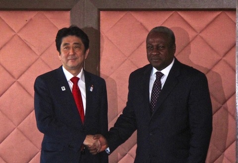 Japanese Prime Minister, Shinzo Abe in a handshake with President John Mahama