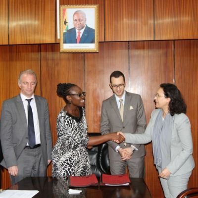 Mrs. Mawuena Trebarh exchanging handshakes with representatives of CIMAF Ghana Limited after the agreement.